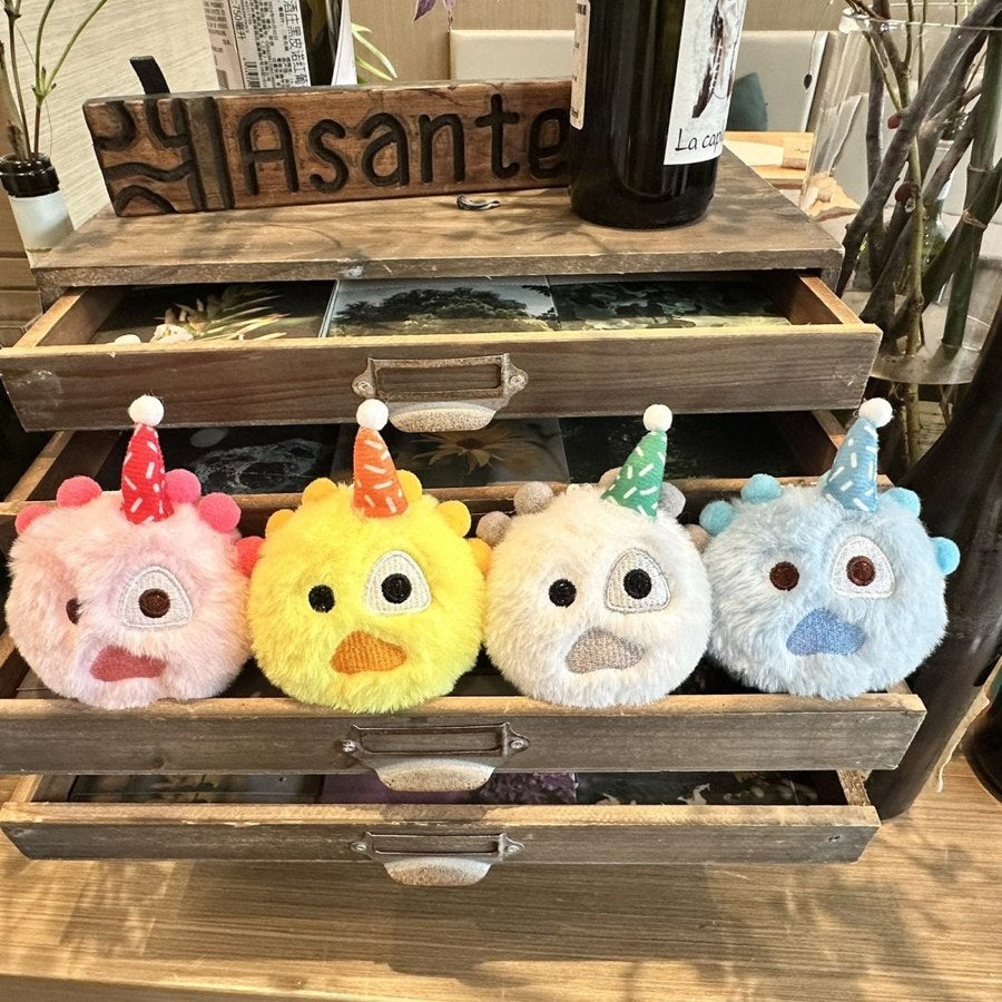 CORTIS unofficial plush balls in pink, yellow, white, and blue